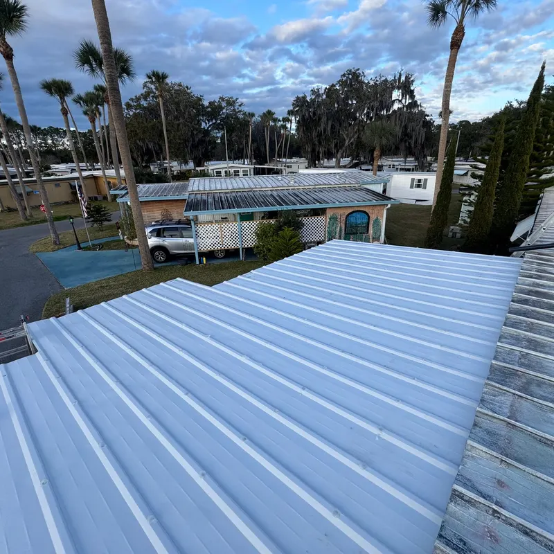 Finished new white aluminum pan roof over a sunroom in Lake County, FL, installed by Pro Specialty Services