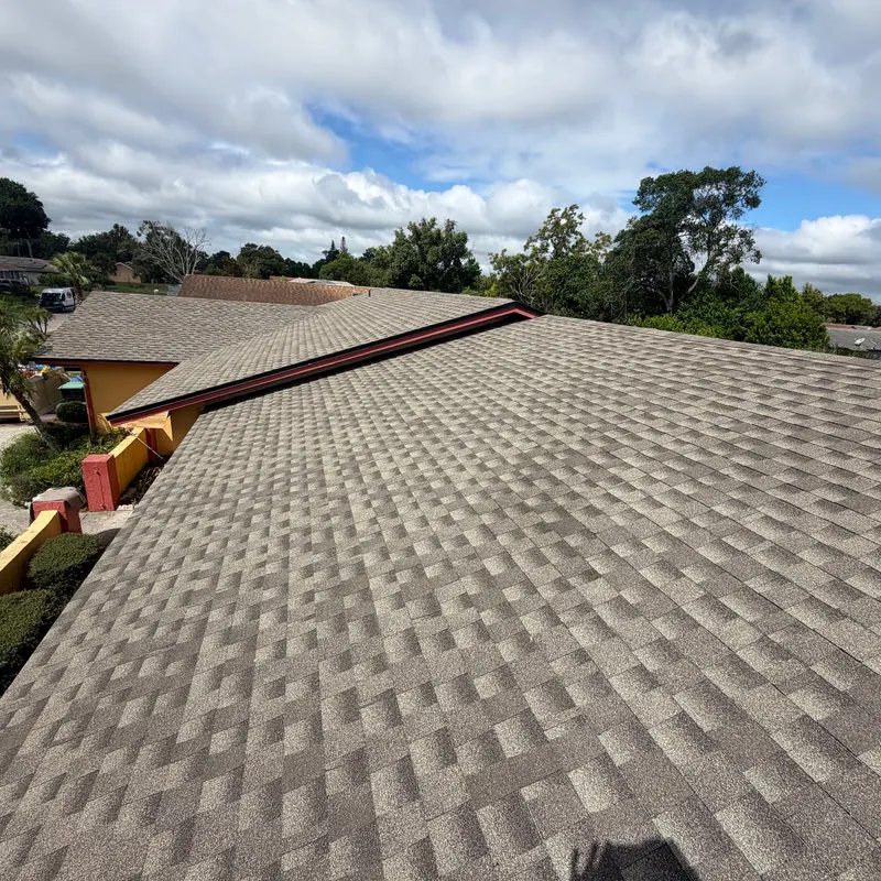 Finished architectural shingle roof seen along the ridge after a Pro Specialty Services re-roof